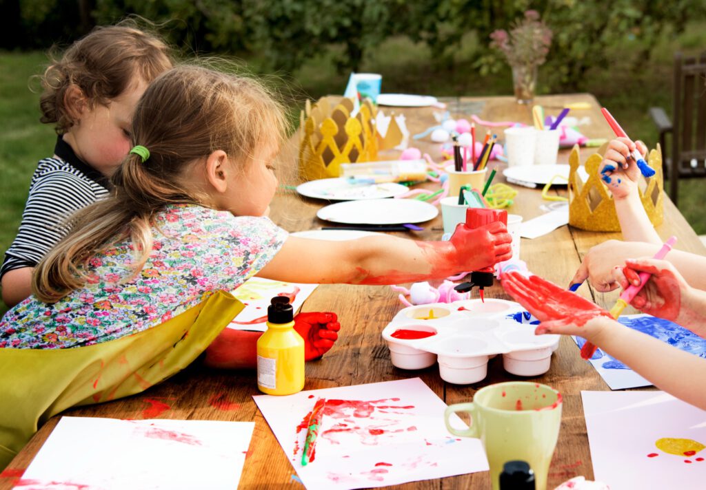 Kids colouring outdoors