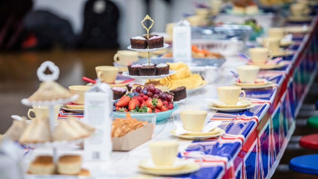 A table at a street party set with food