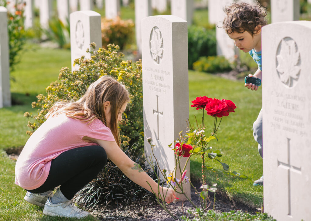 Girl visiting a Commonwealth War Grave