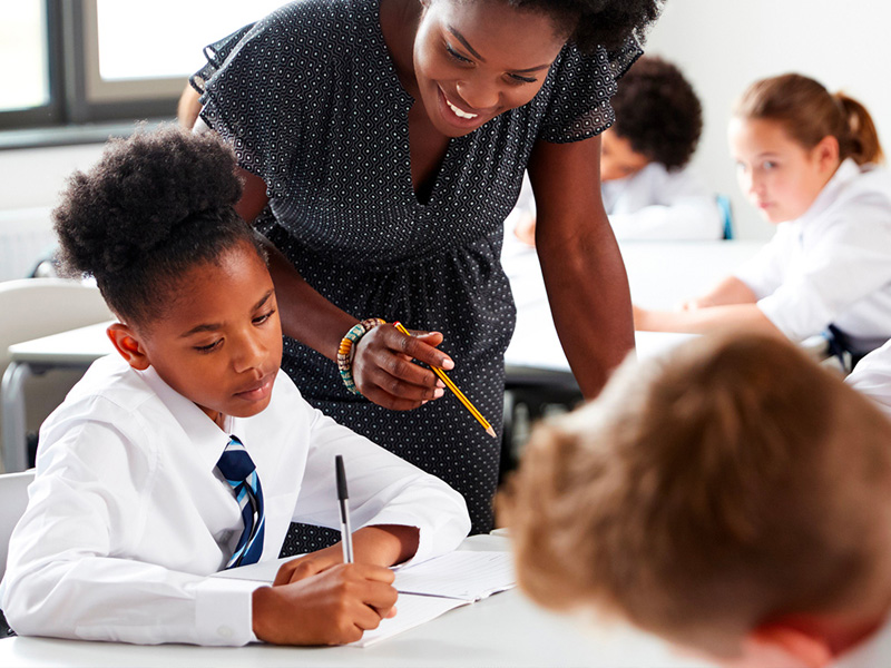 Teacher with pupils in classroom