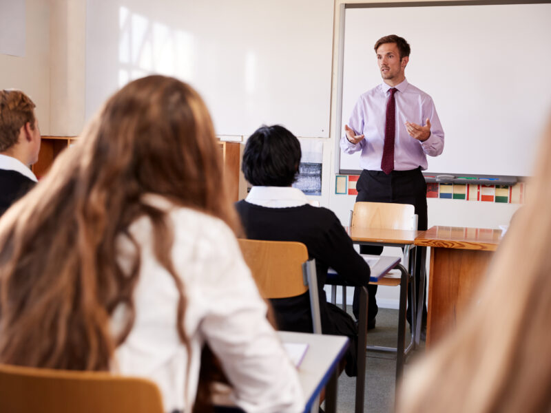 Teacher addressing classroom